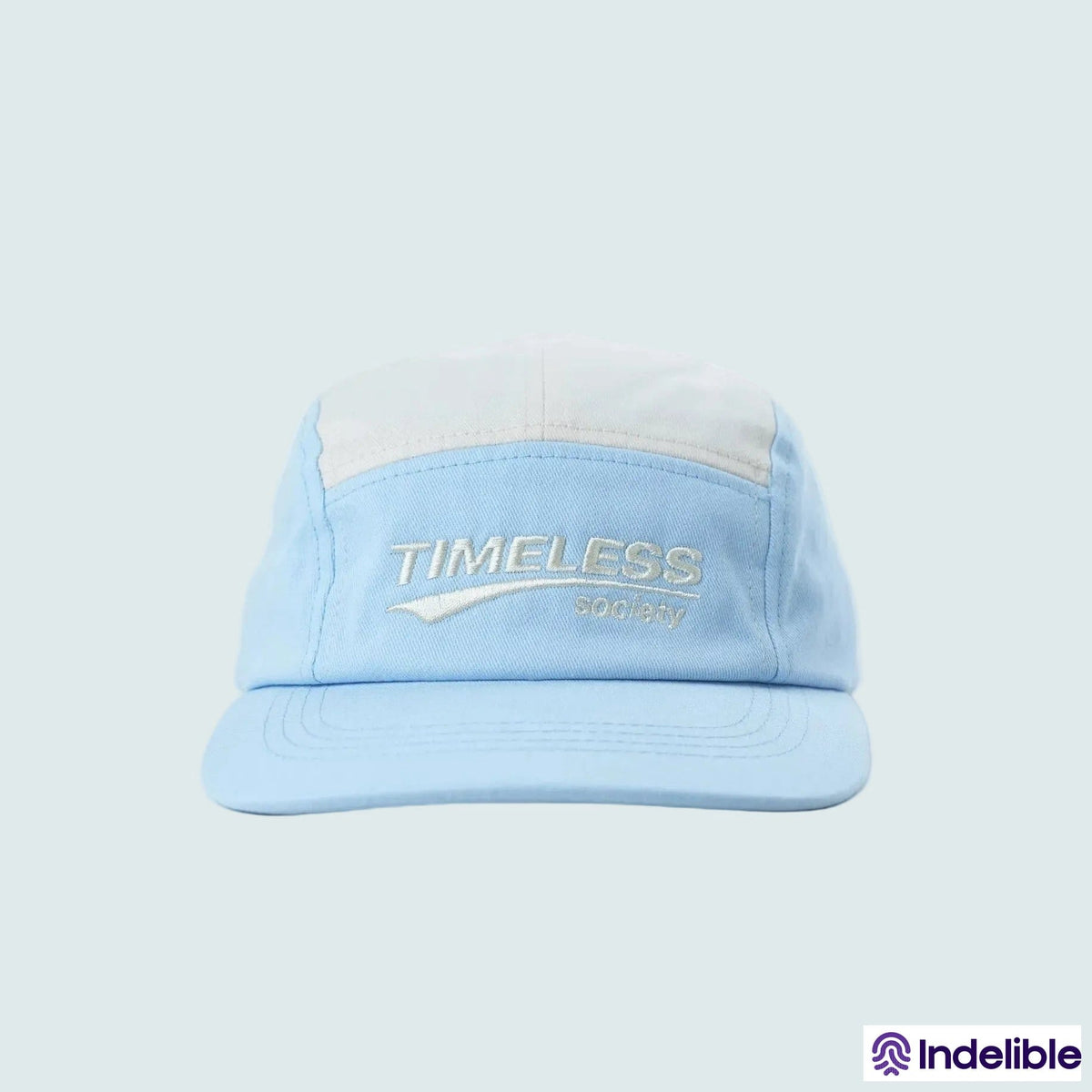 Light blue cap with 'Timeless' logo on a light gray background